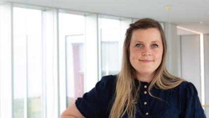 Billede af en smilende kvinde, som er sygeplejerske
